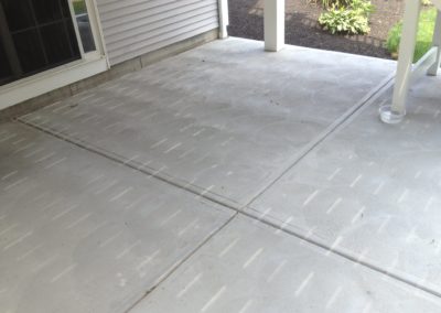 Patio in Johnston. Scroll finish with tooled control joints